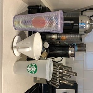 Starbucks cups and coffee steeper